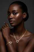 Woman wearing gold jewelry against a dark background