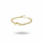 Gold bracelet with charms on a white background
