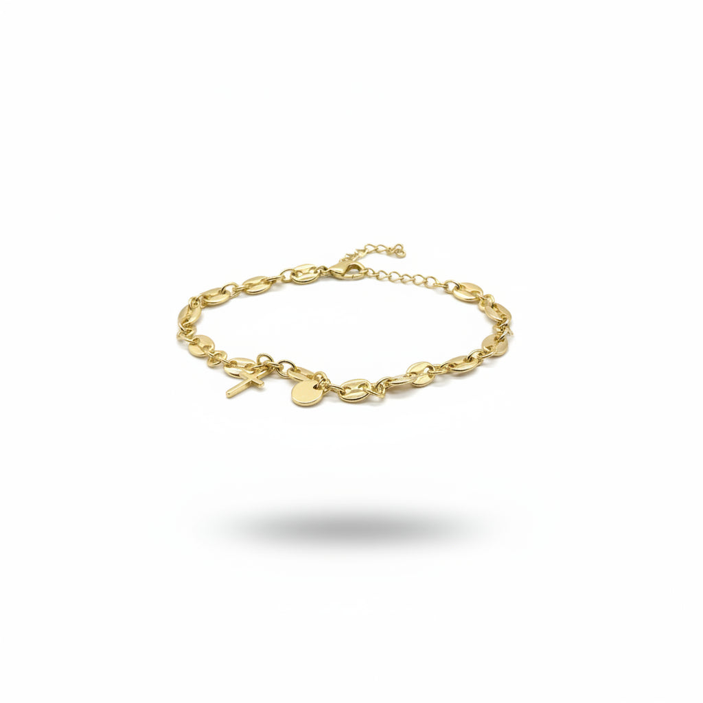 Gold bracelet with charms on a white background