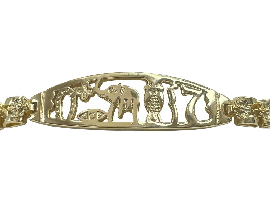 Gold bracelet with animal cut-out design on a white background